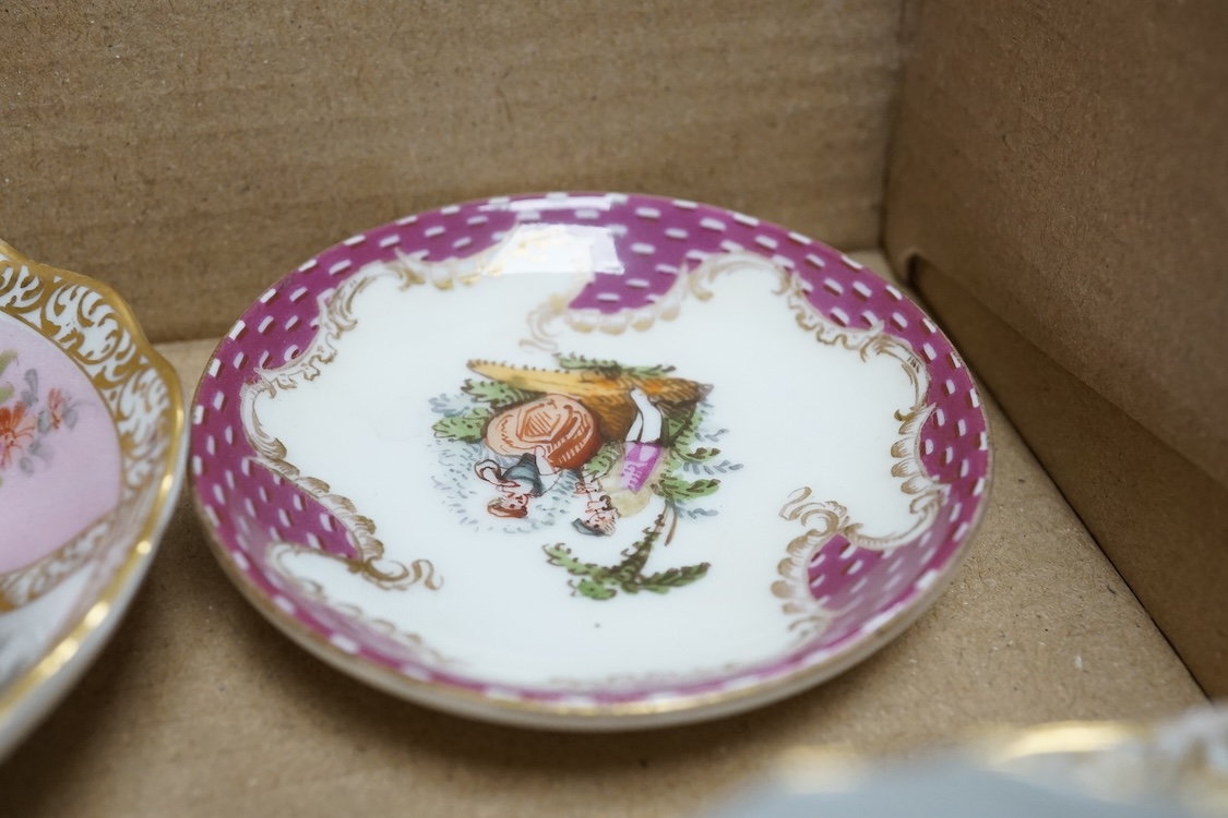 A group of 19th/20th century German porcelain, comprising a Nymphenburg pug, seven Dresden miniature cups and saucers and a Meissen bottle, largest 13cm high